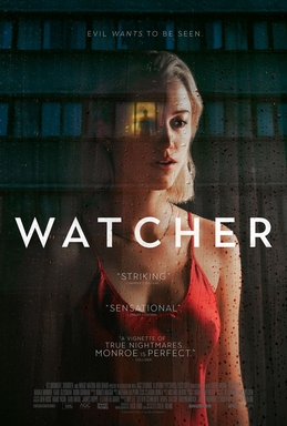 Poster for Watcher features Maika Monroe standing in a window with the reflection of an apartment building across the street. In the center of the building is an illuminated window and the figure of a man.